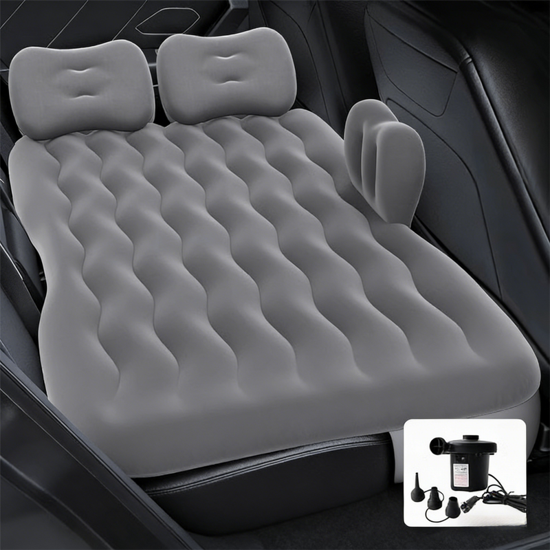 Grey multi-chamber inflatable car air mattress with electric pump and pillows, designed for backseat sleeping and camping.