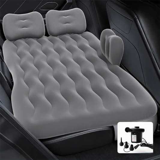 Grey multi-chamber inflatable car air mattress with electric pump and pillows, designed for backseat sleeping and camping.
