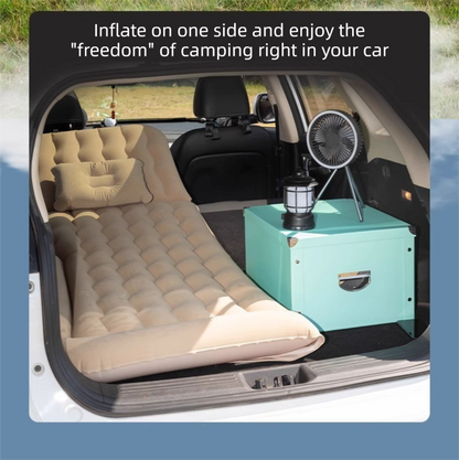 Grey multi-chamber inflatable car air mattress with electric pump and pillows, designed for backseat sleeping and camping.