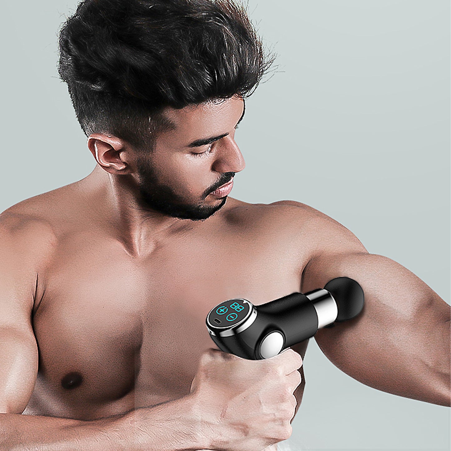 Hlpmedical FitSmart LCD display mini vibration therapy massage device in black, designed for relaxing massage therapy sessions.