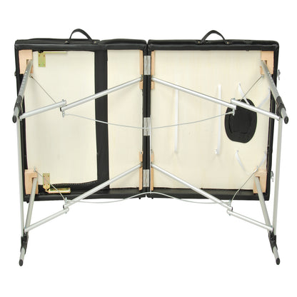 Black 3-fold portable aluminium massage table by YES4HOMES, used for beauty therapy and massage treatments.