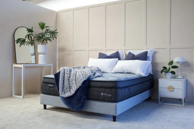 Hlpmedical And Sleep Prime Queen Mattress shown in a bedroom setting with plush fabric and supportive design for comfortable sleep.