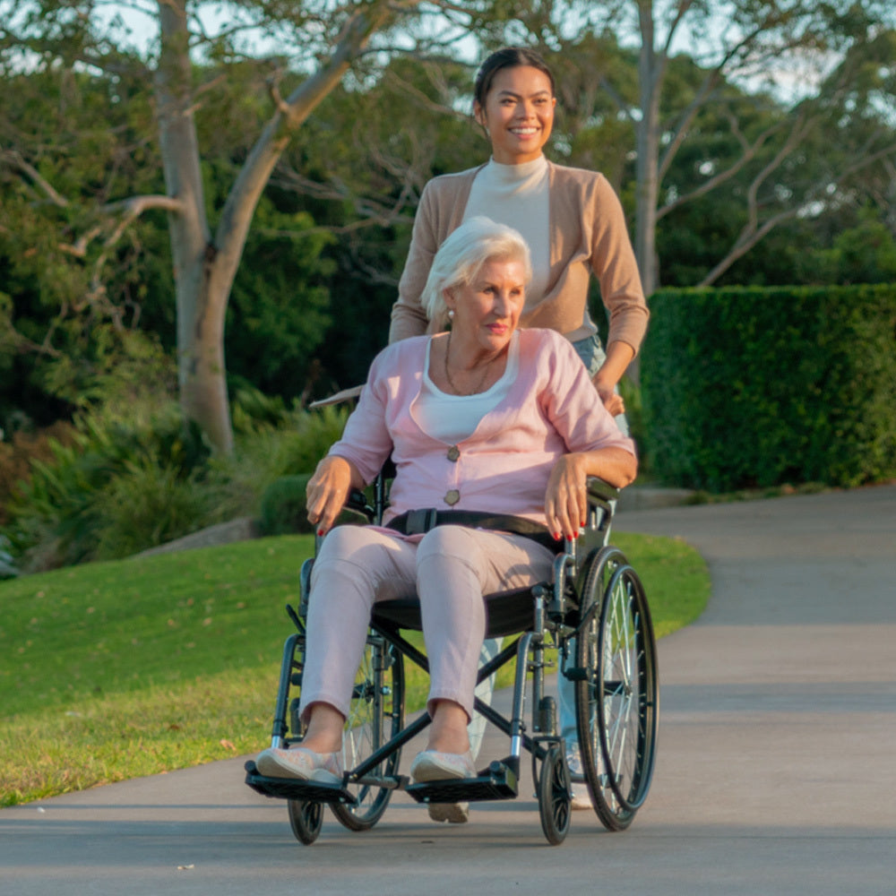Equipmed 24-inch folding bariatric wheelchair by Hlpmedical with dark grey hammertone finish, XL wide design, park brakes, and retractable armrests.