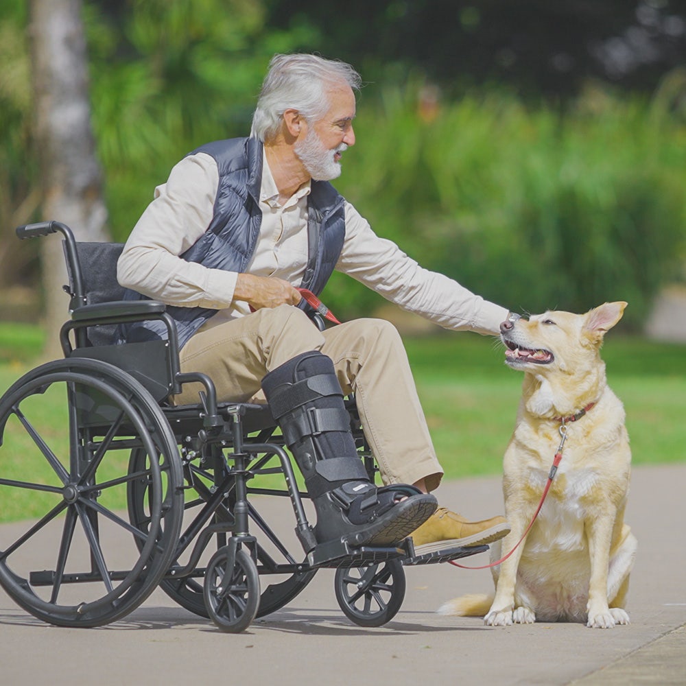 Black EQUIPMED 24-inch folding wheelchair with park brakes, 136kg capacity, and 51cm wide seat, designed for mobility and comfort.