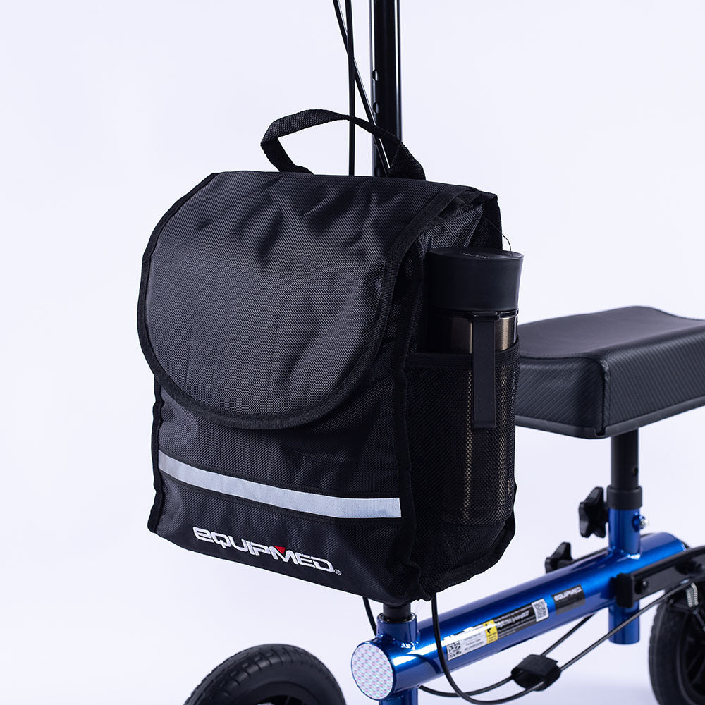 Blue EQUIPMED Knee Scooter Walker with 10-inch tires, dual brakes, and storage bag for broken leg or foot mobility aid.