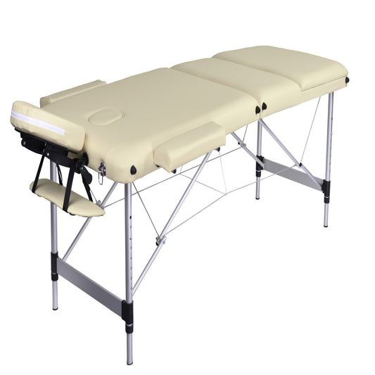 Hlpmedical YES4HOMES 3-fold portable aluminum massage table in beige, used for beauty therapy and relaxation treatments.