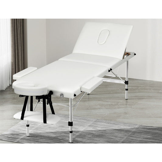 White Zenses portable massage table with 65cm width, 3-fold aluminum design for health and beauty relaxation sessions.