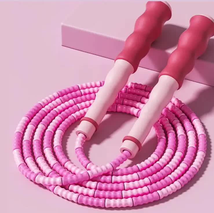 Set of 10 pink beaded jump ropes with adjustable segments, tangle-free design for kids and adults' fitness workouts.