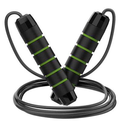 Set of five black and green adjustable steel wire jump ropes with ball bearings for cardio, boxing, and fitness workouts.