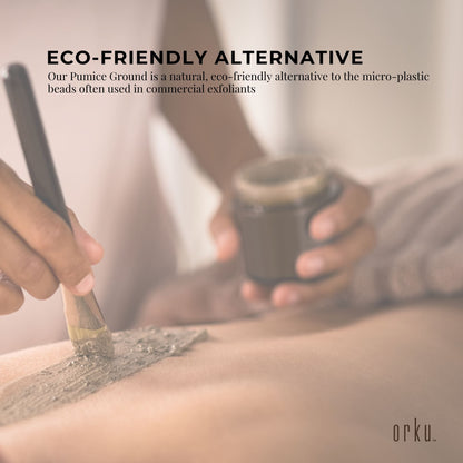 Ground pumice stone granular powder in a tub, used as an exfoliant body scrub additive for skincare and fitness routines.