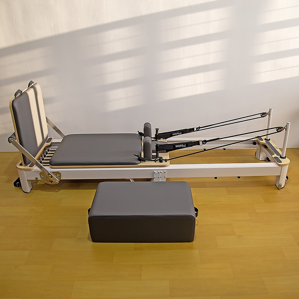 Hlpmedical folding Pilates reformer machine for full-body home workout, exercise, yoga, and fitness training.