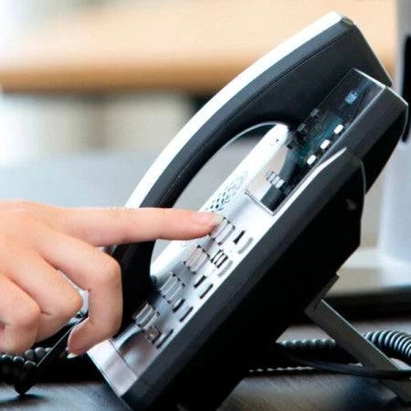Yealink SIP-T42S business IP phone with dual-port Gigabit Ethernet and PoE, featuring a color display and multiple line keys.